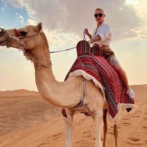 Veranstaltung: Sunset Desert Safari with Quad Bike, Sandboarding, Camel Ride + BBQ Dinner, Burj Khalifa in Dubai